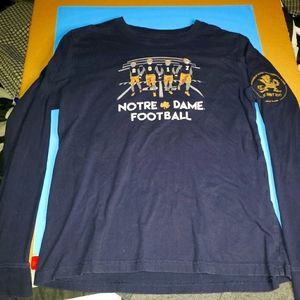 notre dame shirt with graphics on front and back.